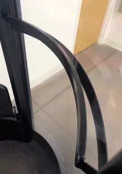 Black curved handrail installed inside a PVE30 or PVE37 home elevator cabin for passenger support