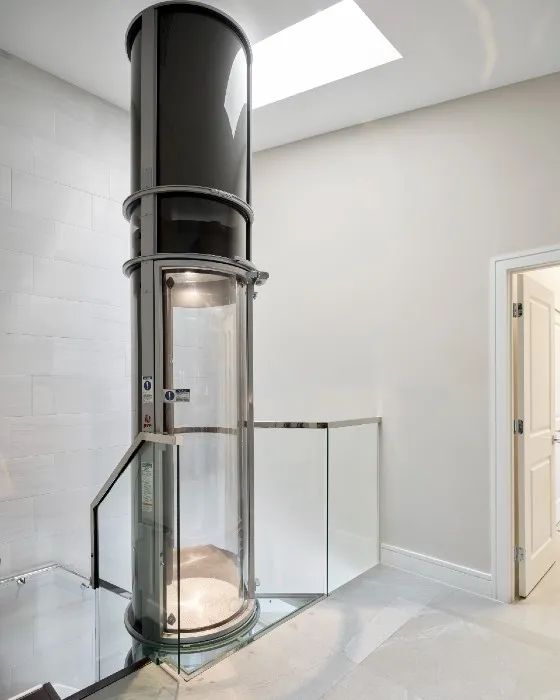 PVE home elevator with upper floor extension reaching ceiling for a clean finish