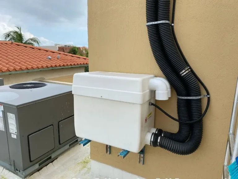 Exterior vacuum pump unit mounted on outside wall for a PVE home elevator installation