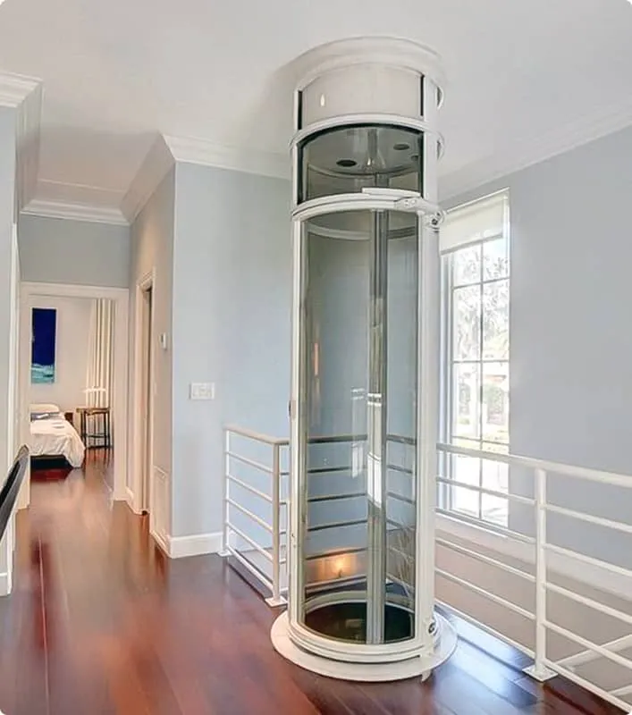 PVE30 round pneumatic vacuum elevator installed on a wood floor upstairs landing