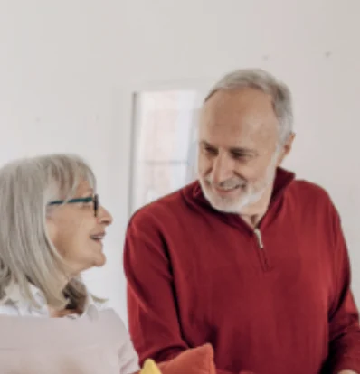 Smiling senior couple, happy customers sharing their positive experience with a PVE home elevator